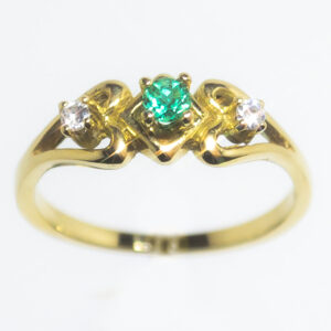 anillo de compromiso en oro 18k con esmeralda y diamantes